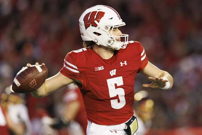 Nov 26, 2022; Madison, Wisconsin, USA; Wisconsin Badgers quarterback Graham Mertz (5) throws a pass during the third quarter against the Minnesota Golden Gophers at Camp Randall Stadium. Mandatory Credit: Jeff Hanisch-USA TODAY Sports
